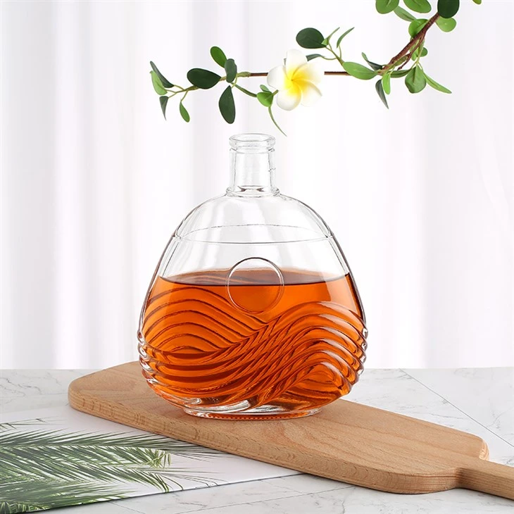 Transparent Bottle With Wavy Pattern And Silver Crown Cap